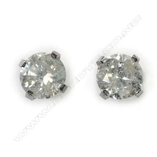 A pair of 14ct white gold and diamond stud earrings,