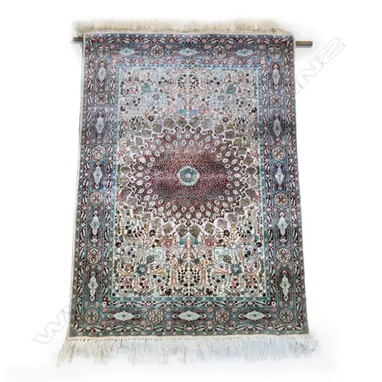 A fine hand-knotted silk rug,