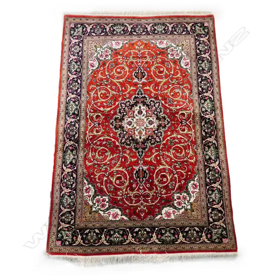 #A Persian hand-knotted silk rug