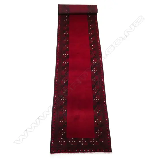 A long hand-knotted wool pile Turkman runner,