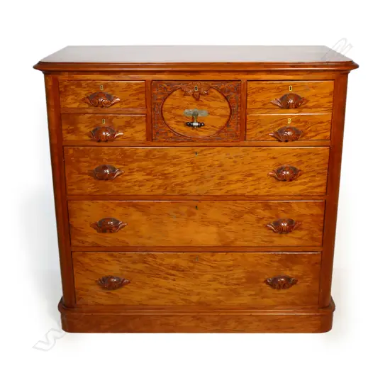 A colonial mottled kauri chest of drawers,