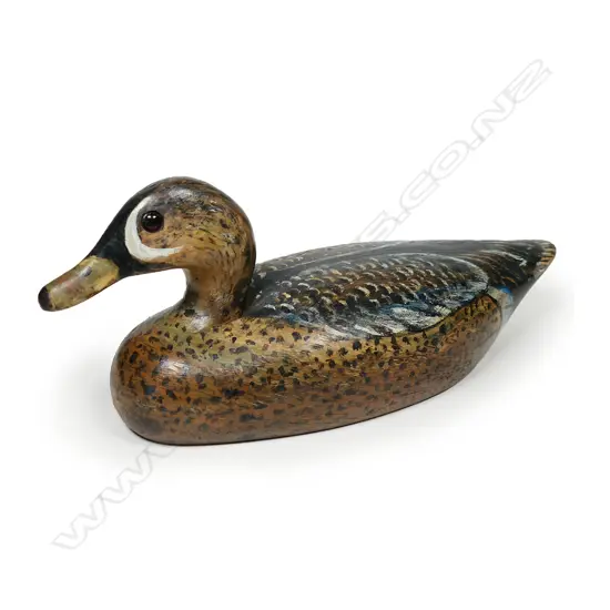 An 11½" wooden hand carved and painted blue wing teal decoy,