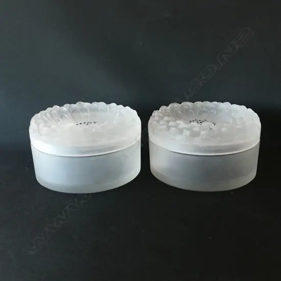 A pair of Lalique glass Dahlia dressing table boxes,