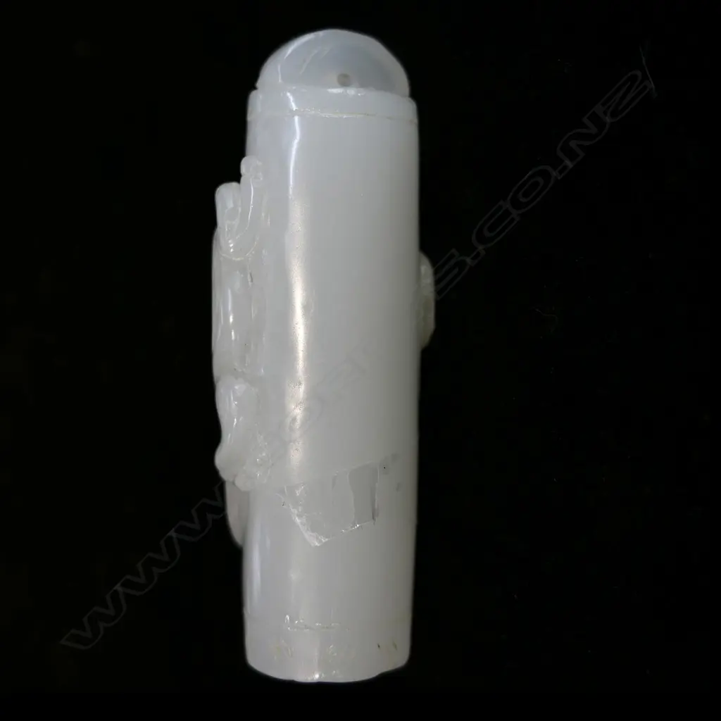 A Chinese carved pale green/white jade pendant, Image 1++