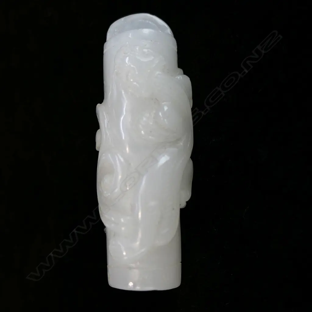 A Chinese carved pale green/white jade pendant, Image 1++