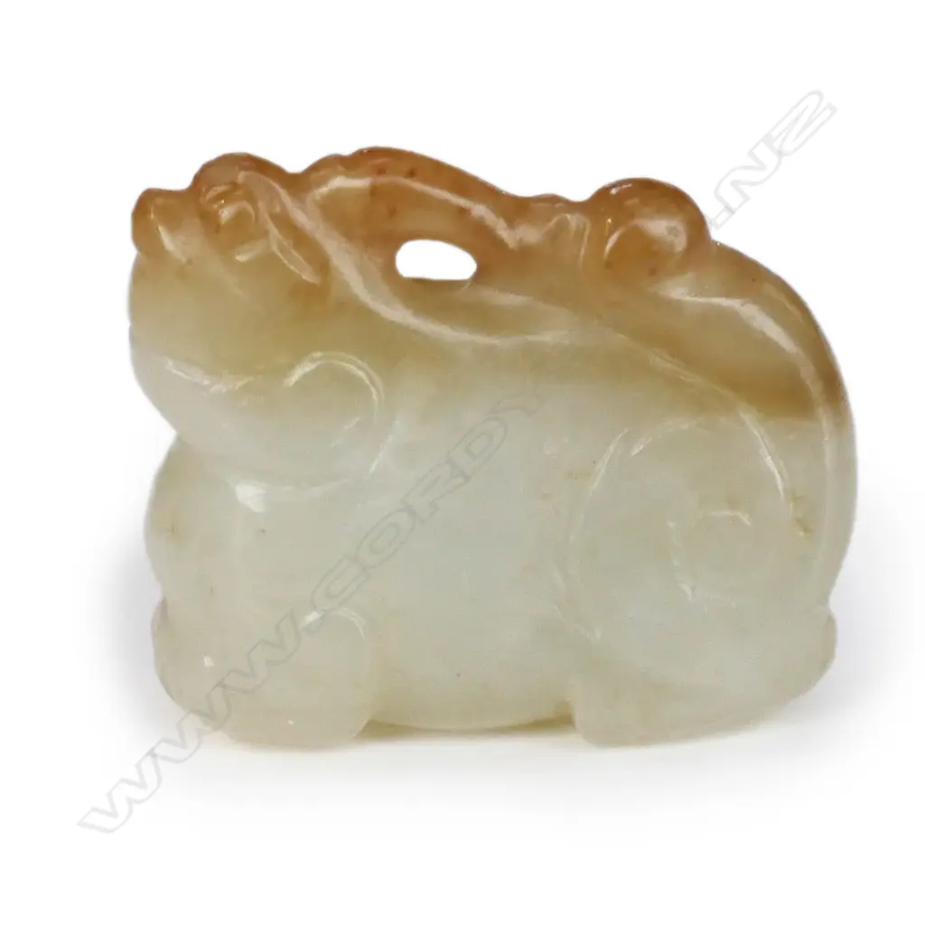 A Chinese carved pale jade pendant of a mythical beast, Image 1++