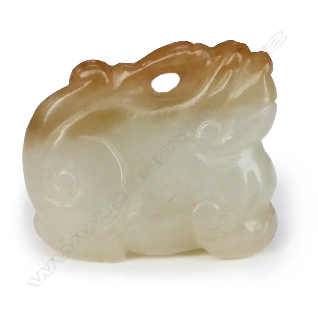 A Chinese carved pale jade pendant of a mythical beast, Image 1++