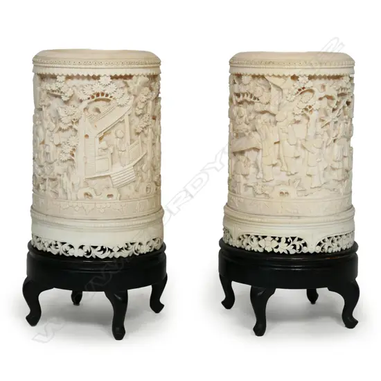 A pair of 19thC finely carved ivory brush pots,