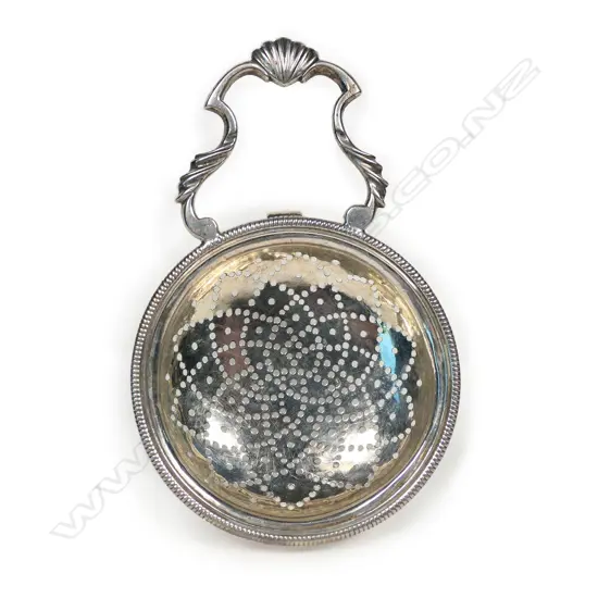 A George III silver lemon/orange strainer,