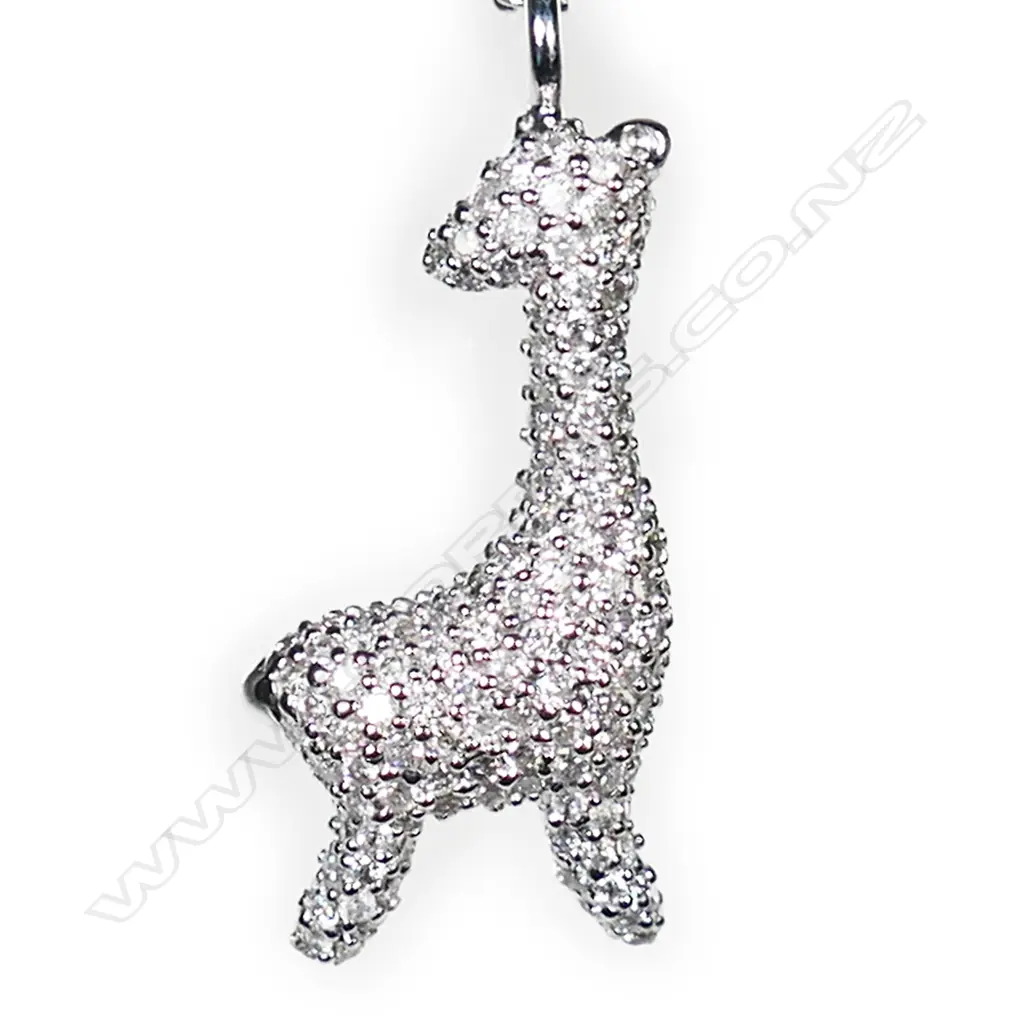 A 9ct white gold and diamond set giraffe pendant, Image 1++