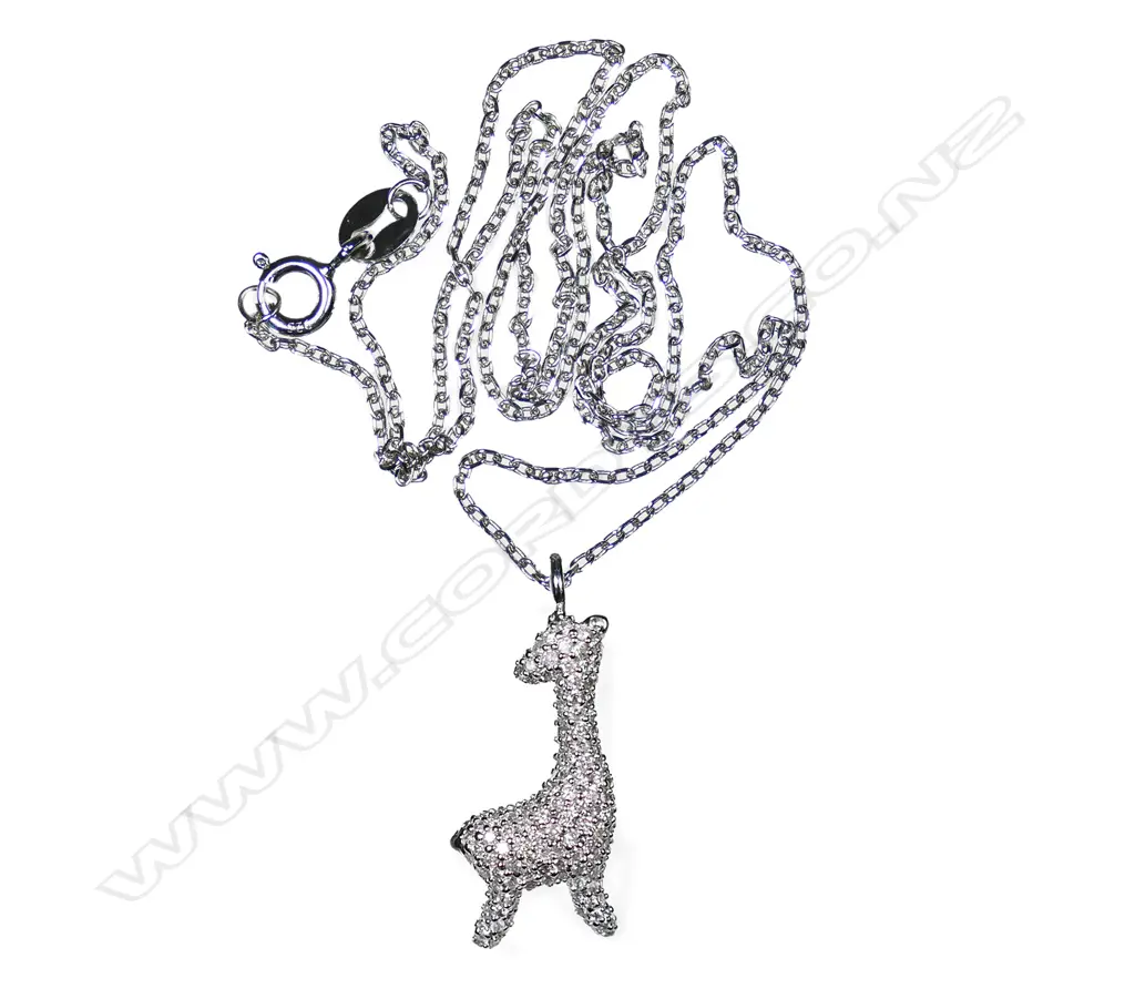 A 9ct white gold and diamond set giraffe pendant, Image 1++