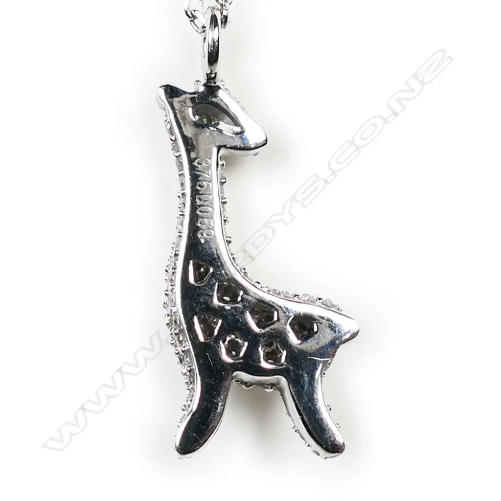 A 9ct white gold and diamond set giraffe pendant, Image 1++