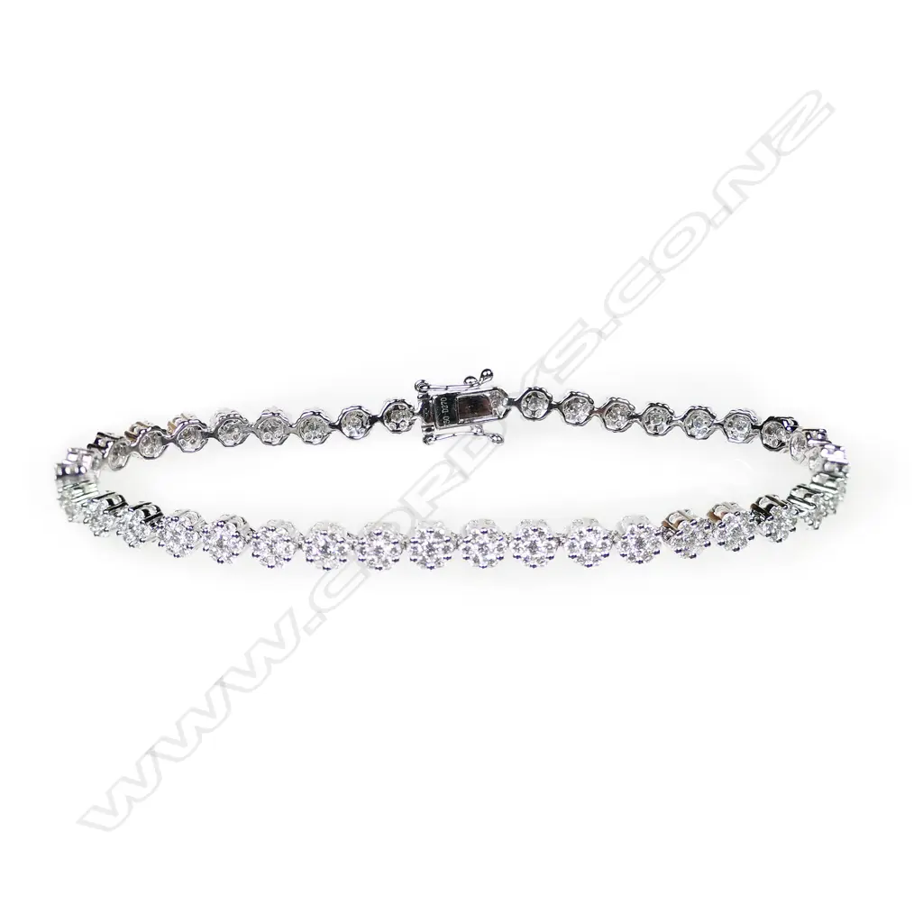 An 18ct white gold and multi diamond cluster bracelet, Image 1++