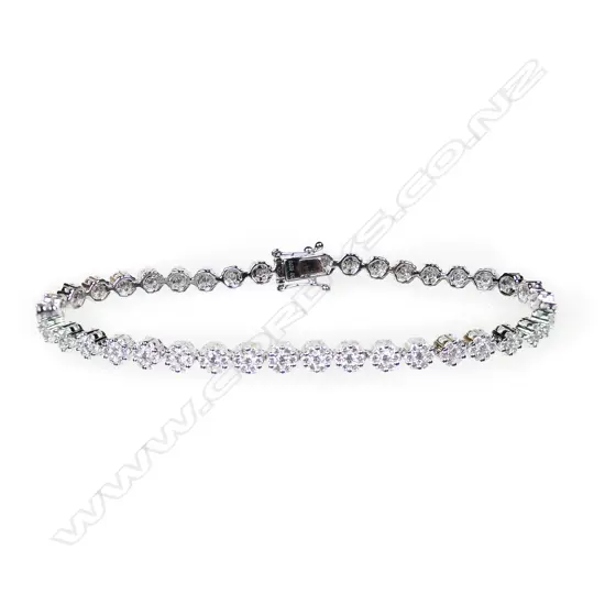 An 18ct white gold and multi diamond cluster bracelet,