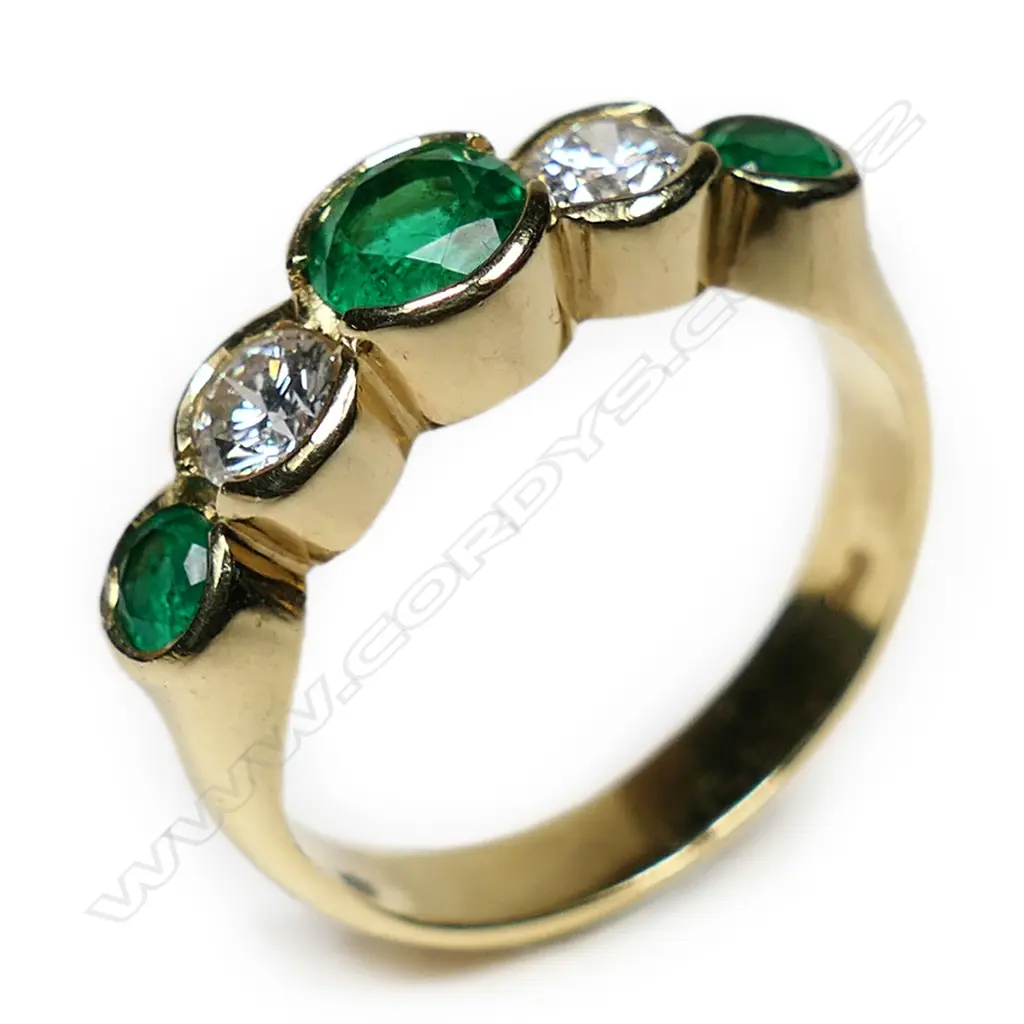 An 18ct yellow gold emerald and diamond ring, Image 1++