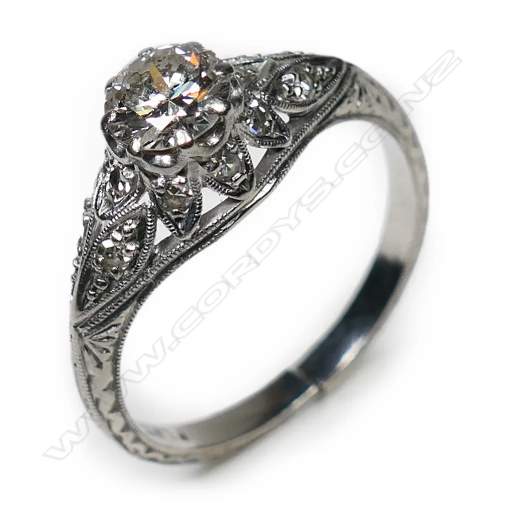 An estate platinum and diamond solitaire ring, Image 1++