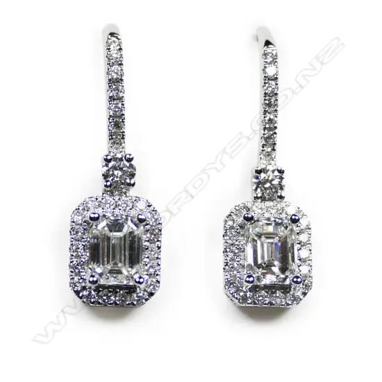 A pair of 18ct white gold and diamond earrings,