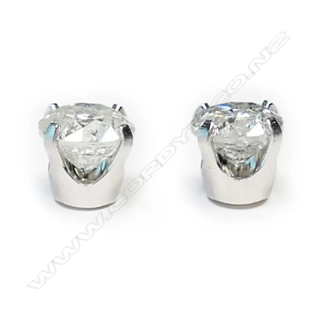 A pair of 14ct white gold and diamond stud earrings, Image 1++