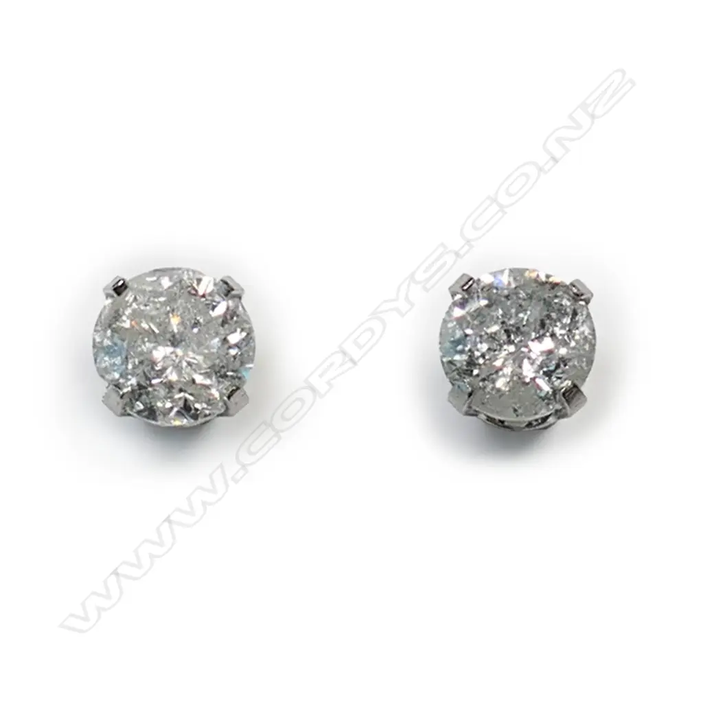 A pair of 14ct white gold and diamond stud earrings, Image 1++