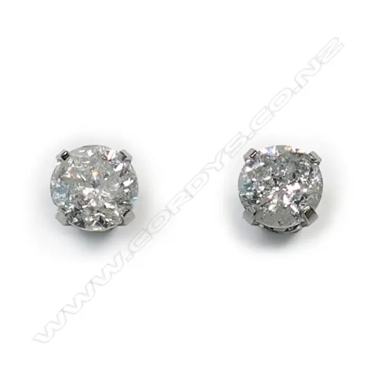 A pair of 14ct white gold and diamond stud earrings,