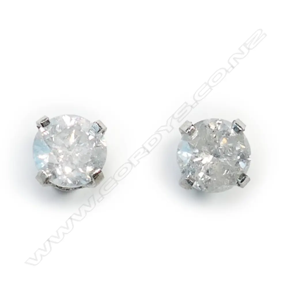 A pair of 14ct white gold and diamond stud earrings, Image 1++