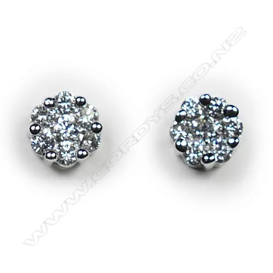 A pair of 18ct white gold and diamond earrings,