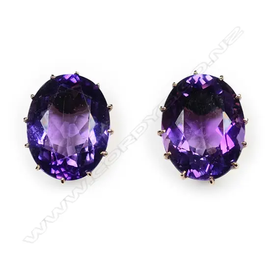 A pair of estate 9ct gold and amethyst stud earrings,