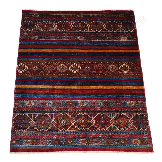 A hand knotted Khurjeen rug,