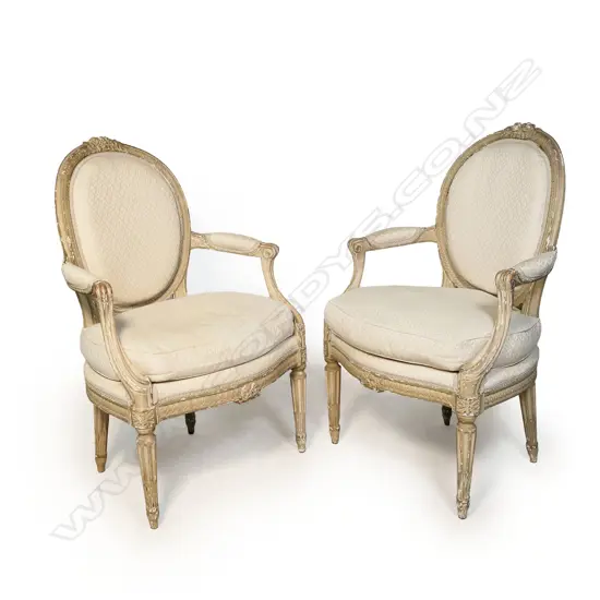 A pair of French open elbow armchairs,