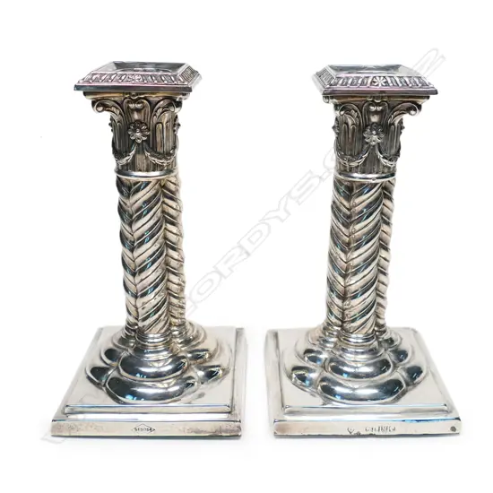 A pair of Victorian silver candlesticks,