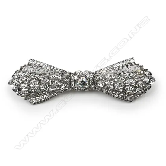 An 18ct white gold and diamond Art Deco bow brooch,