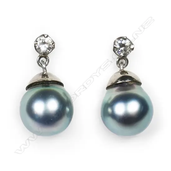 A pair of 18ct white gold diamond and black pearl earrings,