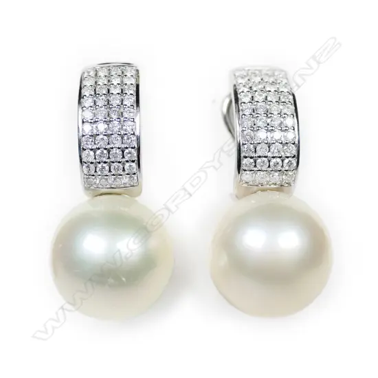 A pair of 14ct white gold, pearl and diamond earrings,