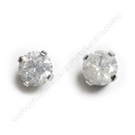 A pair of 14ct white gold and diamond stud earrings,