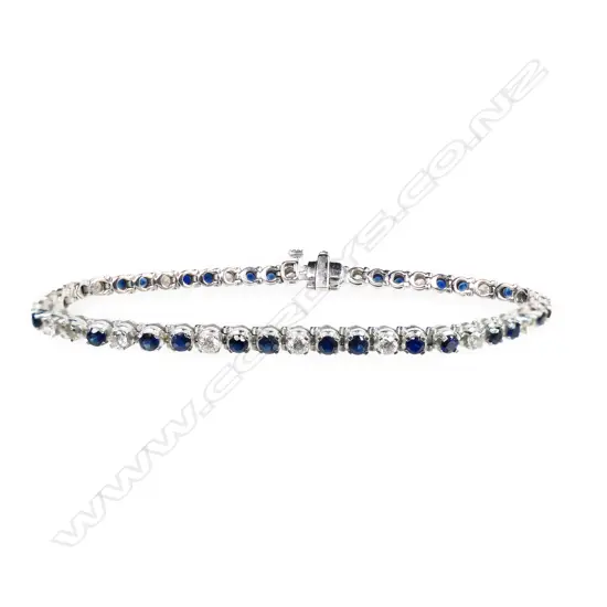 A 9ct white gold sapphire and diamond tennis bracelet,