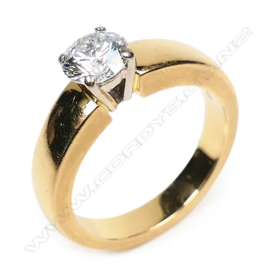 An 18ct yellow gold diamond solitaire ring,