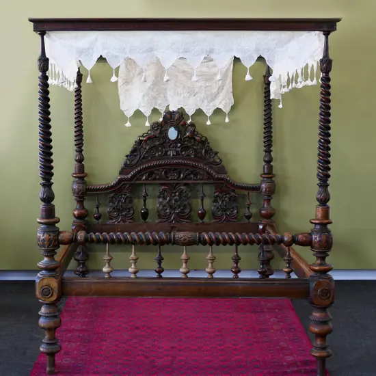 An impressive Victorian mahogany full tester bed,