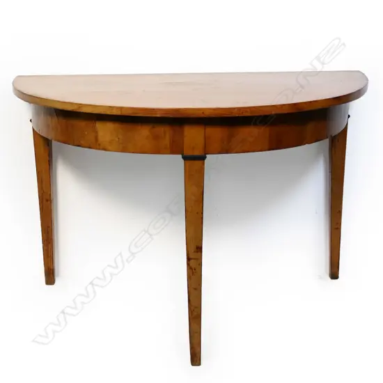 A 19thC European Biedermeier exotic pale wood demi-lune table,