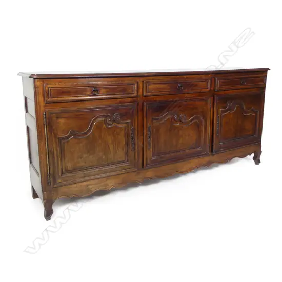 A large oak French style sideboard,