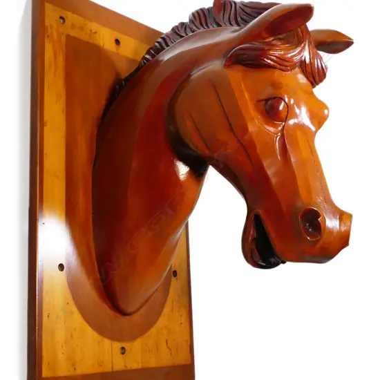 A very large carved wood wall mounting horses head,