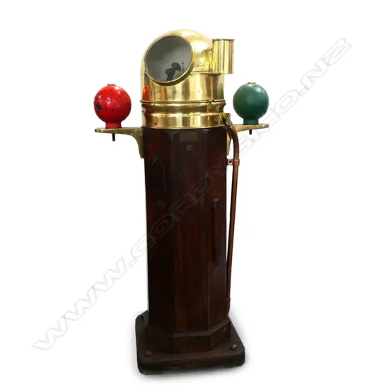 A ship's binnacle compass, octagonal teak case on square plinth base, with brass glazed dome and fittings, flanked by red and green painted steel balls, the Hartmann, Hamburg compass with Lilley & Reynolds, London card. H.1500mm.