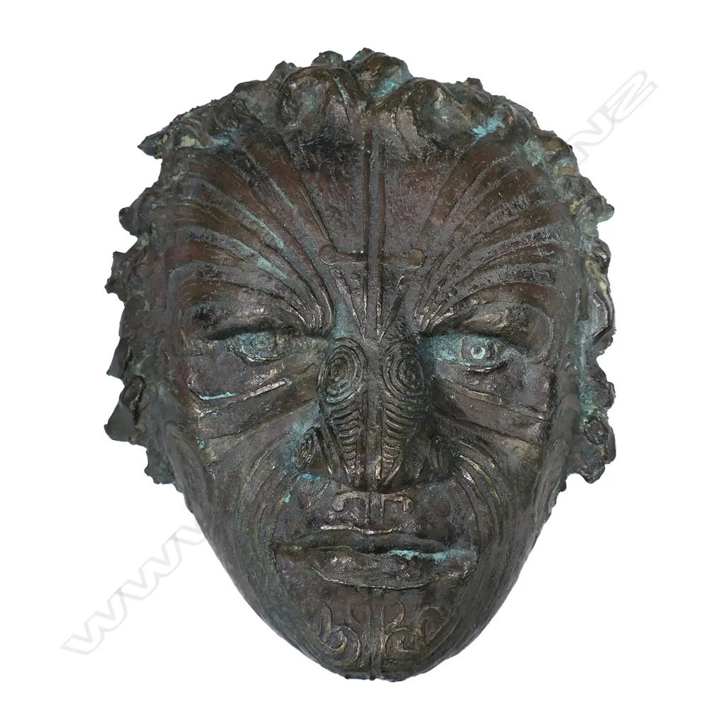 A contemporary bronze sculpture of a male Māori face, Image 1++