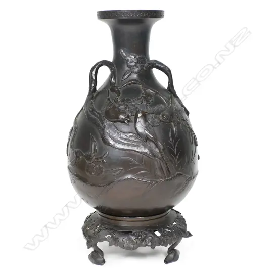 A Japanese Meiji period bronze vase on matched stand,