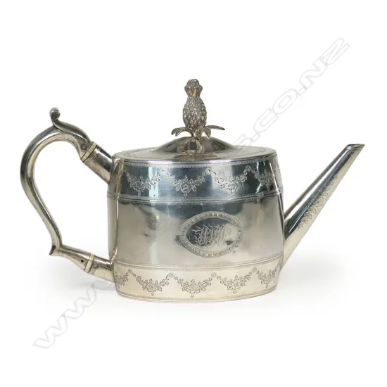 An uncommon George III silver teapot with pineapple finial,