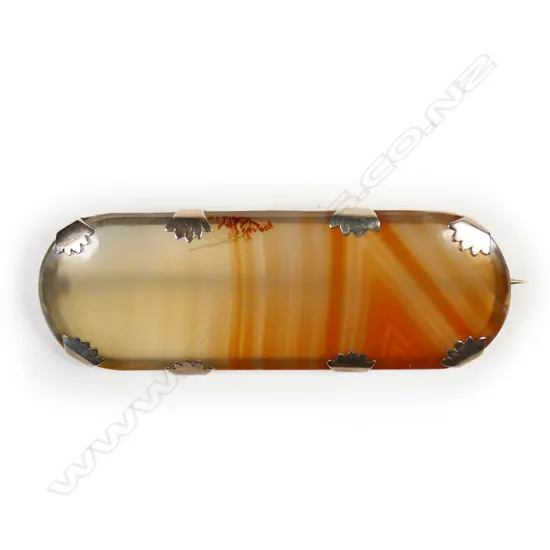 A large lozenge form banded agate and gold mounted brooch,