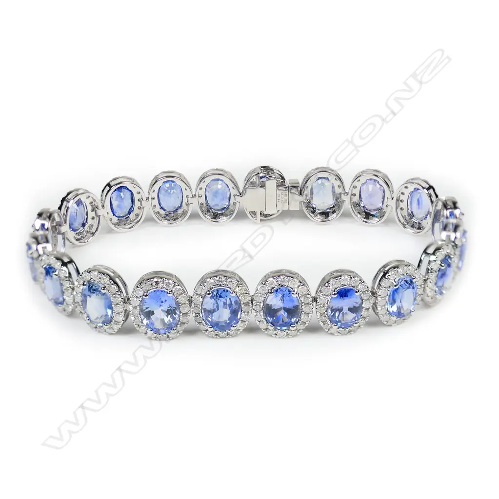 A 14ct white gold Ceylon sapphire and diamond halo bracelet, Image 1++