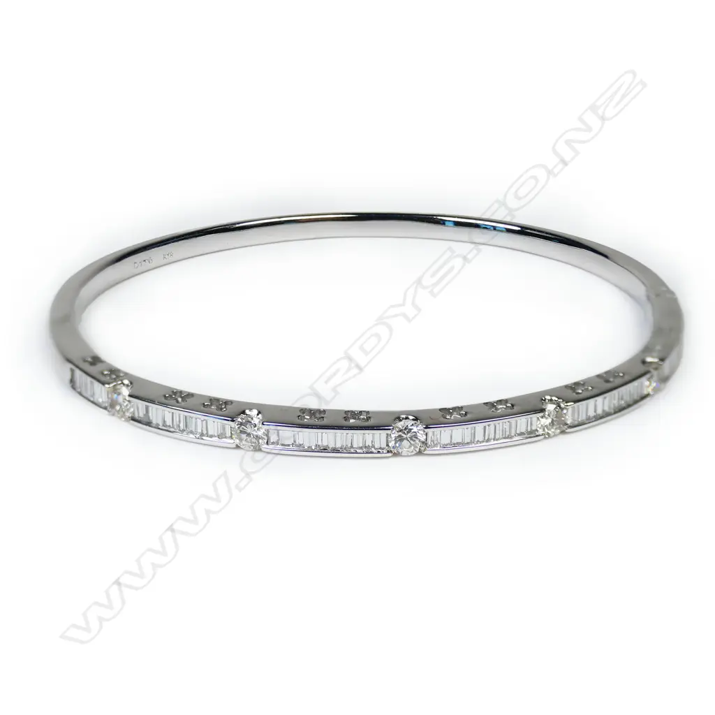 An 18ct white gold and diamond hinged bangle, Image 1++