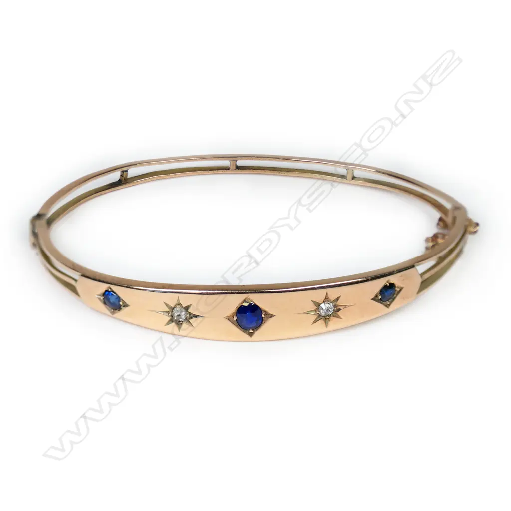 An Edwardian 9ct rose gold diamond and sapphire hinged bangle, Image 1++