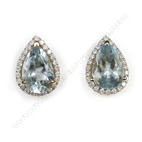 A pair of 14ct yellow gold aquamarine and diamond halo stud earrings,