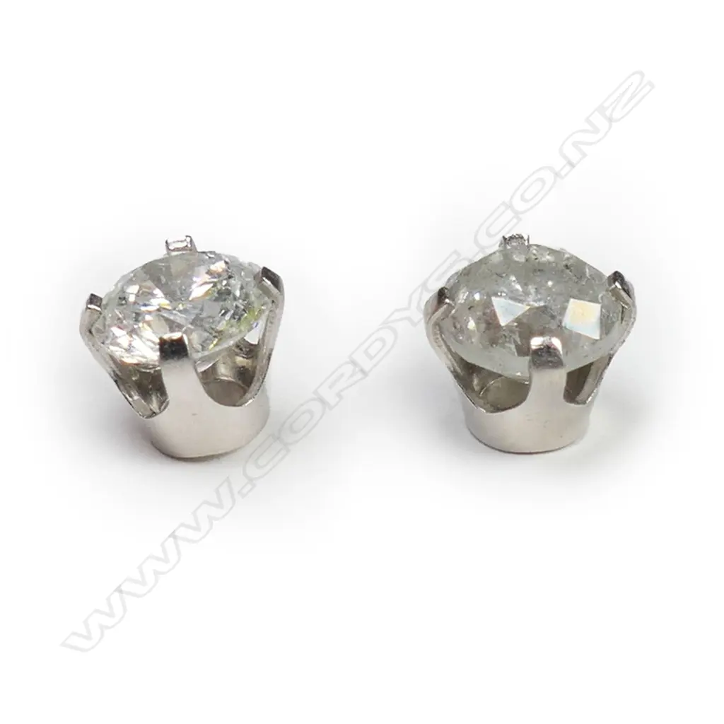 A pair of 14ct white gold and diamond stud earrings, Image 1++